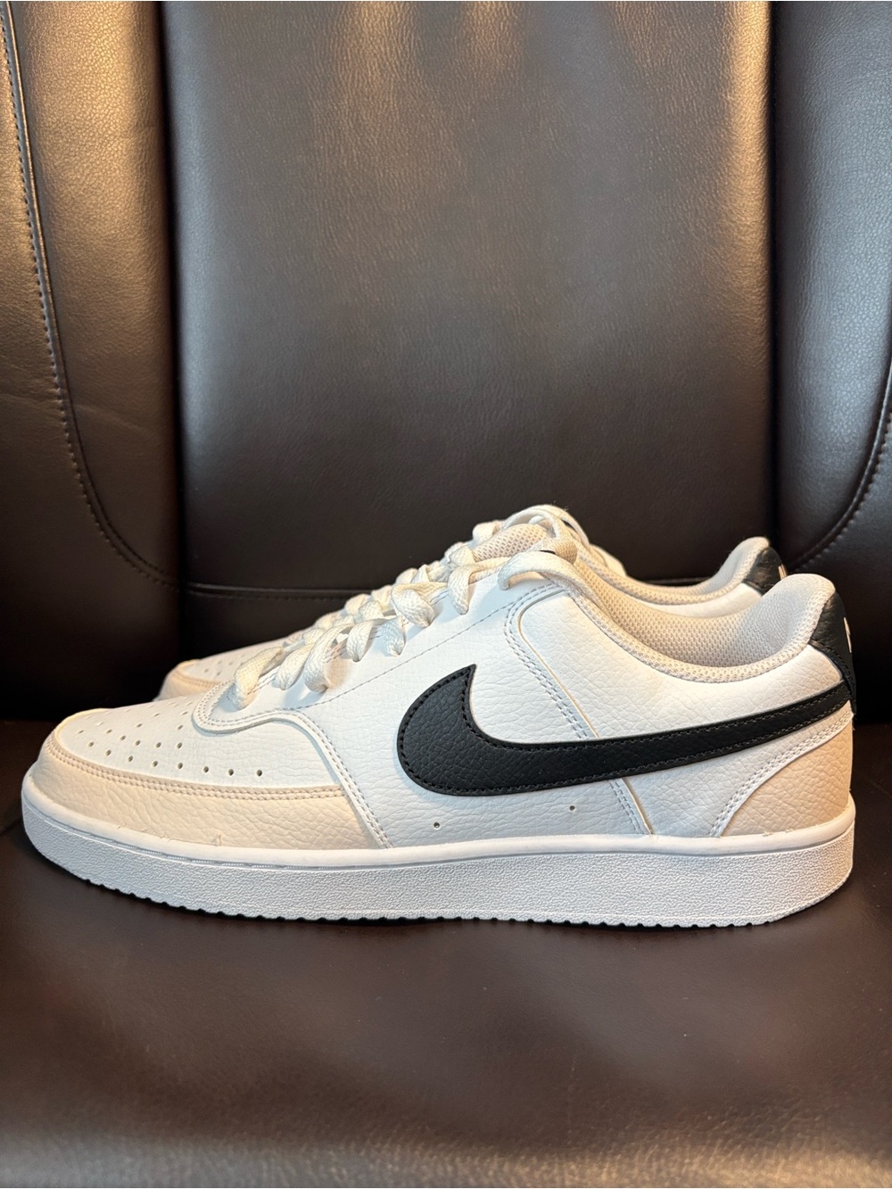 Nike White Low-Top Sneakers with Black Swoosh